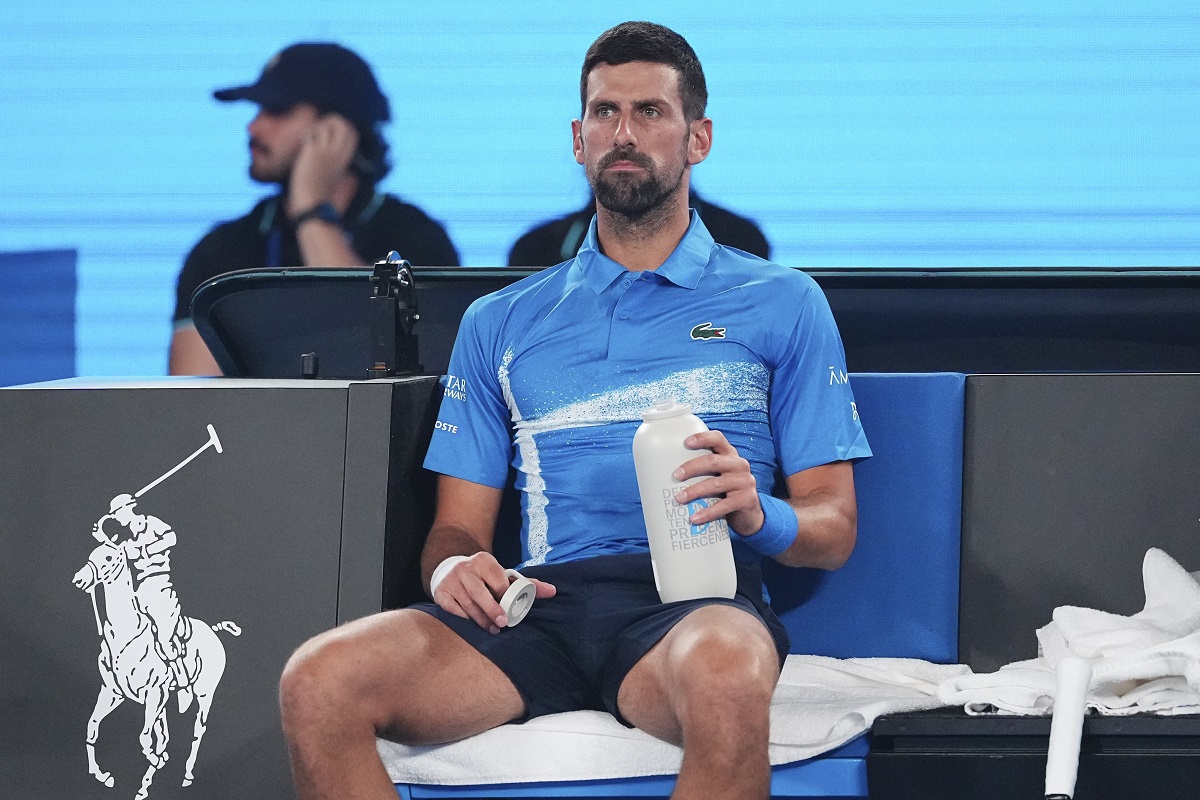 Serbia's Novak Djokovic takes a drink during a break in his exhibition match against Germany's Alexander Zverev ahead of the Australian Open tennis championship in Melbourne, Australia, Thursday, Jan. 9, 2025. (AP Photo/Vincent Thian)