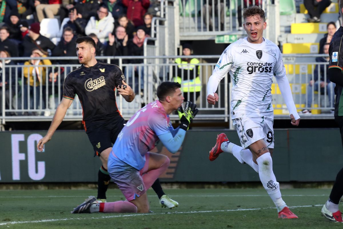 Empoli's Sebastiano Esposito, right, celebrates after scoring his side's first goal of the game during the Serie A soccer match between Venezia and Empoli at the Pier Luigi Penzo Stadium, in Venice, Italy, Saturday Jan. 4, 2025. (Paola Garbuio/LaPresse via AP)