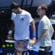 Serbia's Novak Djokovic walks with his coach Andy Murray, right, during a practice session ahead of the Australian Open tennis championship in Melbourne, Australia, Saturday, Jan. 11, 2025. (AP Photo/Ng Han Guan)