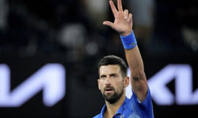 Novak Djokovic of Serbia celebrates after defeating Carlos Alcaraz of Spain in their quarterfinal match at the Australian Open tennis championship in Melbourne, Australia, Wednesday, Jan. 22, 2025. (AP Photo/Vincent Thian)