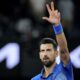 Novak Djokovic of Serbia celebrates after defeating Carlos Alcaraz of Spain in their quarterfinal match at the Australian Open tennis championship in Melbourne, Australia, Wednesday, Jan. 22, 2025. (AP Photo/Vincent Thian)