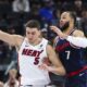 Los Angeles Clippers guard Amir Coffey (7) defends against Miami Heat forward Nikola Jovic (5) during the second half of an NBA basketball game, Monday, Jan. 13, 2025, in Los Angeles. (AP Photo/Jessie Alcheh)