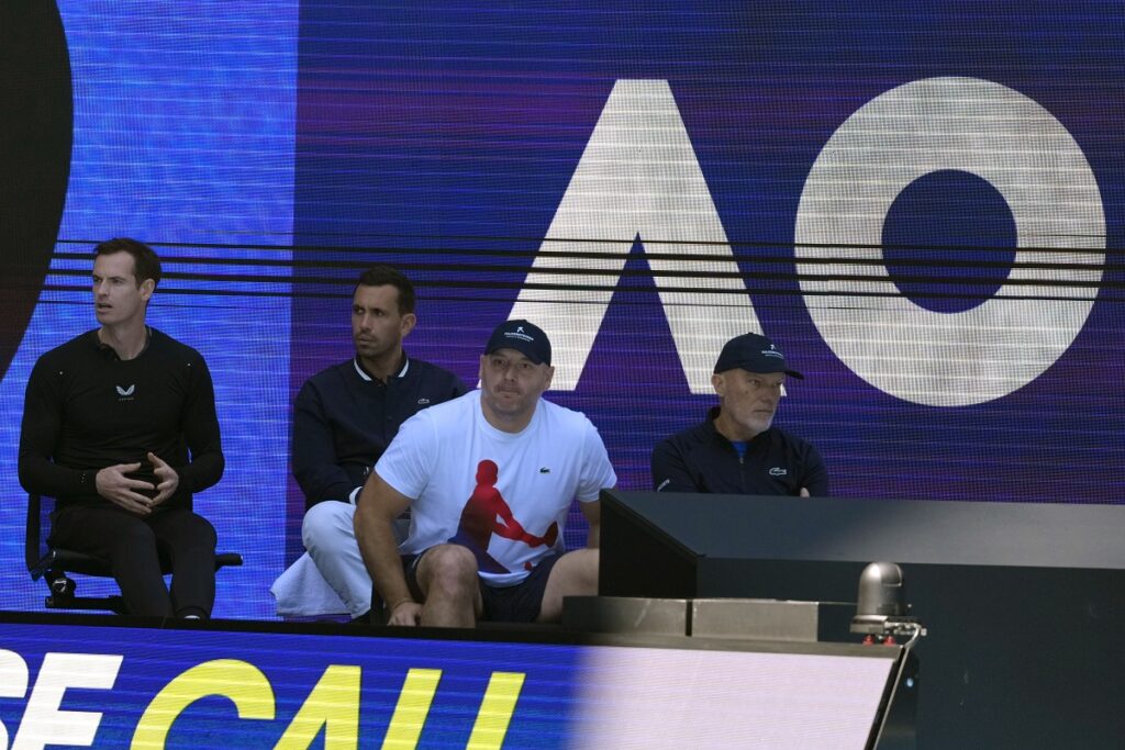 Andy Murray, left, coach of Novak Djokovic of Serbia, watches his semifinal match against Alexander Zverev of Germany at the Australian Open tennis championship in Melbourne, Australia, Friday, Jan. 24, 2025. (AP Photo/Manish Swarup)