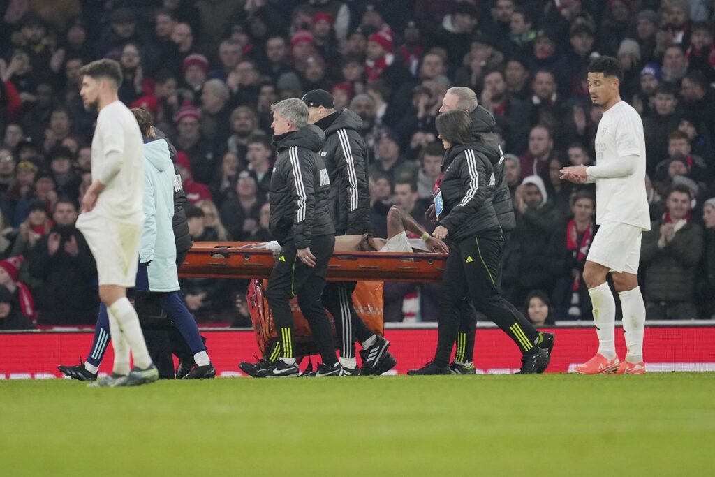 Arsenal's Gabriel Jesus is taken from the pitch by medical staff on a stretcher after injuring during the English FA Cup soccer match between Arsenal and Manchester United at the Emirates stadium in London, Sunday, Jan. 12, 2025. (AP Photo/Kin Cheung)