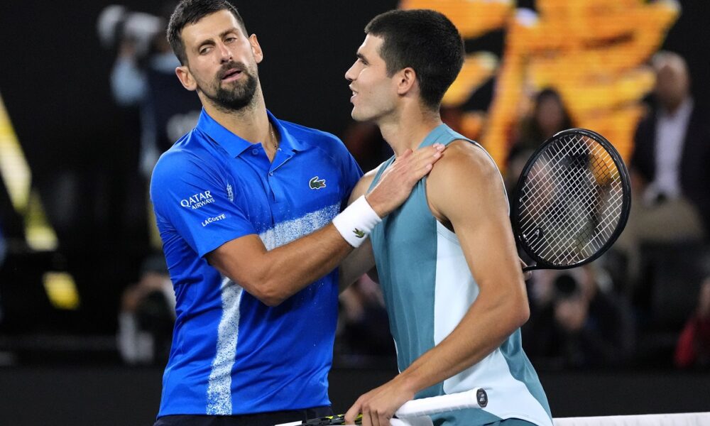 Novak Djokovic, left, of Serbia, is congratulated by Carlos Alcaraz of Spain following their quarterfinal match at the Australian Open tennis championship in Melbourne, Australia, Wednesday, Jan. 22, 2025. (AP Photo/Vincent Thian)