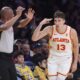 Atlanta Hawks guard Bogdan Bogdanovic, right, gestures after scoring during the first half of an NBA basketball game against the Los Angeles Lakers, Friday, Jan. 3, 2025, in Los Angeles. (AP Photo/Mark J. Terrill)