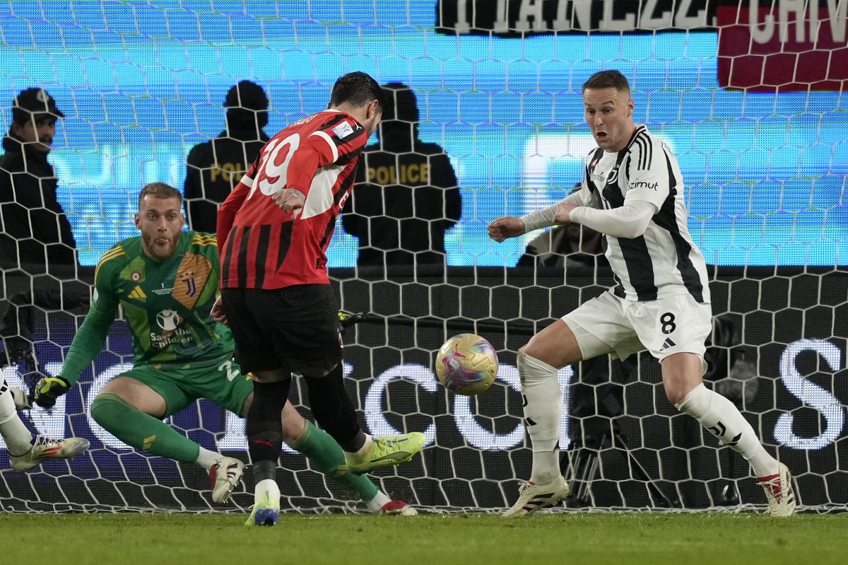 AC Milan's Theo Hernandez misses during the Italian Super Cup semifinal soccer match between Juventus and Milan in Riyadh, Saudi Arabia, Friday, Jan. 3, 2025. (AP Photo/Altaf Qadri)