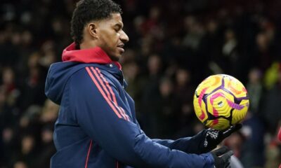 Manchester United's Marcus Rashford holds the ball during the warm up before the English Premier League soccer match between Manchester United and Newcastle at the Old Trafford stadium in Manchester, England, Monday, Dec. 30, 2024. (AP Photo/Dave Thompson)