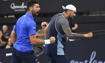 Novak Djokovic of Serbia and Nick Kyrgios of Australia react during their doubles match against Serbia's Nikola Mektic and Michael Venus of New Zealand at the Brisbane International in Brisbane, Australia, Wednesday, Jan. 1, 2025. (Jono Searle/AAP Image via AP)