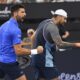 Novak Djokovic of Serbia and Nick Kyrgios of Australia react during their doubles match against Serbia's Nikola Mektic and Michael Venus of New Zealand at the Brisbane International in Brisbane, Australia, Wednesday, Jan. 1, 2025. (Jono Searle/AAP Image via AP)