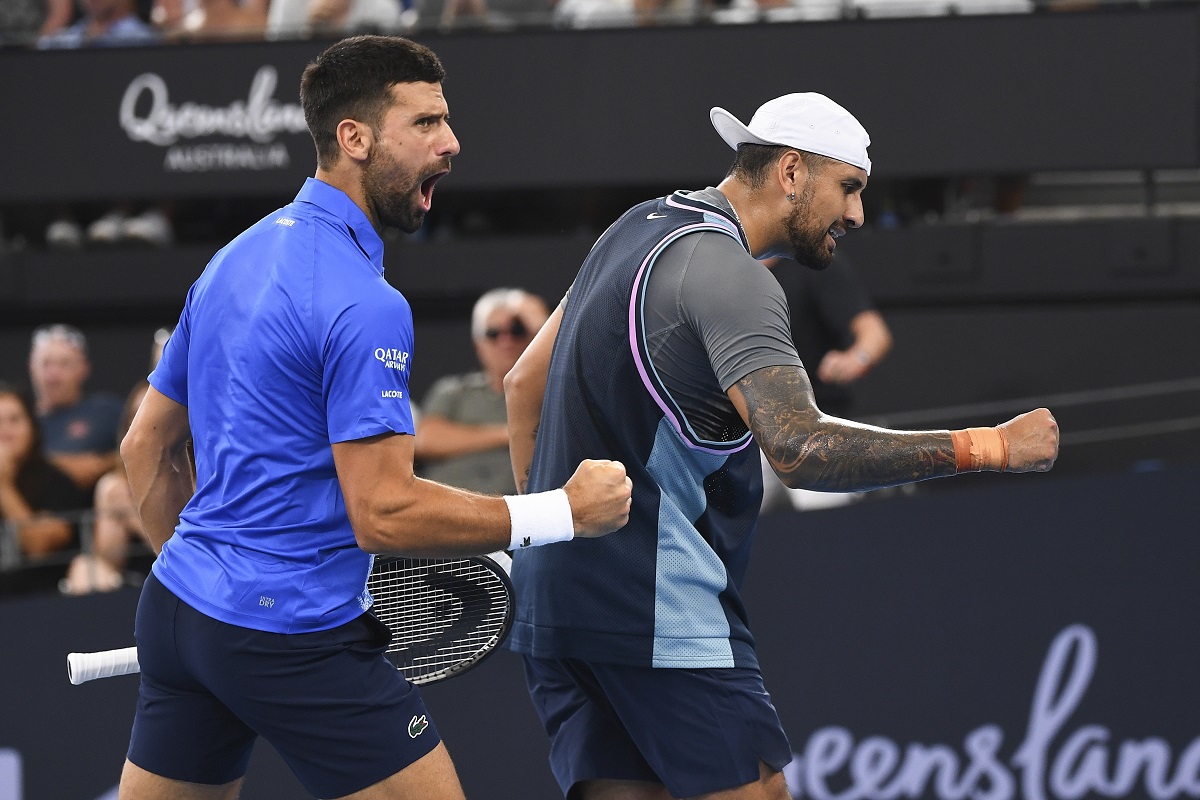 Novak Djokovic of Serbia and Nick Kyrgios of Australia react during their doubles match against Serbia's Nikola Mektic and Michael Venus of New Zealand at the Brisbane International in Brisbane, Australia, Wednesday, Jan. 1, 2025. (Jono Searle/AAP Image via AP)