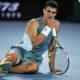 Carlos Alcaraz of Spain reacts following a fall during his quarterfinal match against Novak Djokovic of Serbia at the Australian Open tennis championship in Melbourne, Australia, early Wednesday, Jan. 22, 2025. (AP Photo/Vincent Thian)