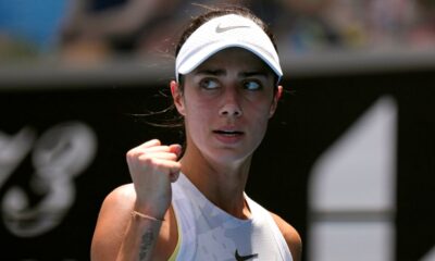 Olga Danilovic of Serbia returns a shot from Paula Badosa of Spain during their fourth round match at the Australian Open tennis championship in Melbourne, Australia, Sunday, Jan. 19, 2025. (AP Photo/Vincent Thian)