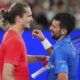 Serbia's Novak Djokovic, right, is congratulated by Germany's Alexander Zverev following their exhibition match ahead of the Australian Open tennis championship in Melbourne, Australia, Thursday, Jan. 9, 2025. (AP Photo/Vincent Thian)