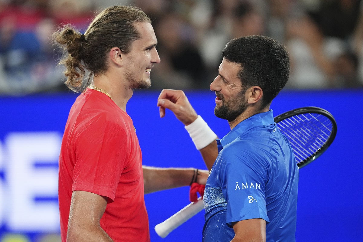 Serbia's Novak Djokovic, right, is congratulated by Germany's Alexander Zverev following their exhibition match ahead of the Australian Open tennis championship in Melbourne, Australia, Thursday, Jan. 9, 2025. (AP Photo/Vincent Thian)