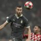 AC Milan's Strahinja Pavlovic, left, jumps above Girona's Abel Ruiz during the Champions League opening phase soccer match between AC Milan and Girona at the San Siro stadium in Milan, Italy, Wednesday, Jan. 22, 2025. (AP Photo/Antonio Calanni)