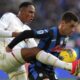 Atalanta's Vanja Vlahovic holds back Cagliari's Terry Mina, left, during the Italian Serie A soccer match between Atalanta and Cagliari at the Gewiss Stadium in Bergamo, Italy, Saturday, Feb. 15, 2025. (Spada/LaPresse via AP)