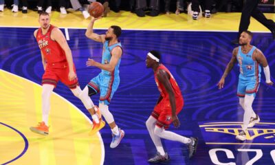 Golden State Warriors guard Stephen Curry shoots between Denver Nuggets center Nikola Jokic, left, and Indiana Pacers forward Pascal Siakam during the NBA All-Star basketball game Sunday, Feb. 16, 2025, in San Francisco. (AP Photo/Jed Jacobsohn)