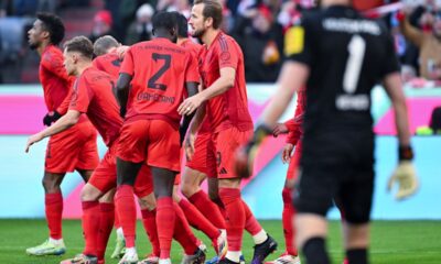 Bayern's Harry Kane, centre, celebrates after scoring his side's third goal during the German Bundesliga soccer match between Bayern Munich and Holstein Kiel at the Allianz Arena in Munich, Germany, Saturday, Feb. 1, 2025 (Sven Hoppe/dpa via AP)