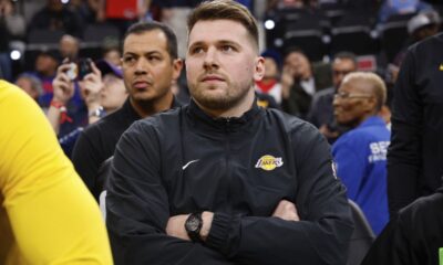 Los Angeles Lakers guard Luka Doncic sits on the bench before an NBA basketball game against the Los Angeles Clippers, Tuesday, Feb. 4, 2025, in Inglewood, Calif. (AP Photo/Kevork Djansezian)