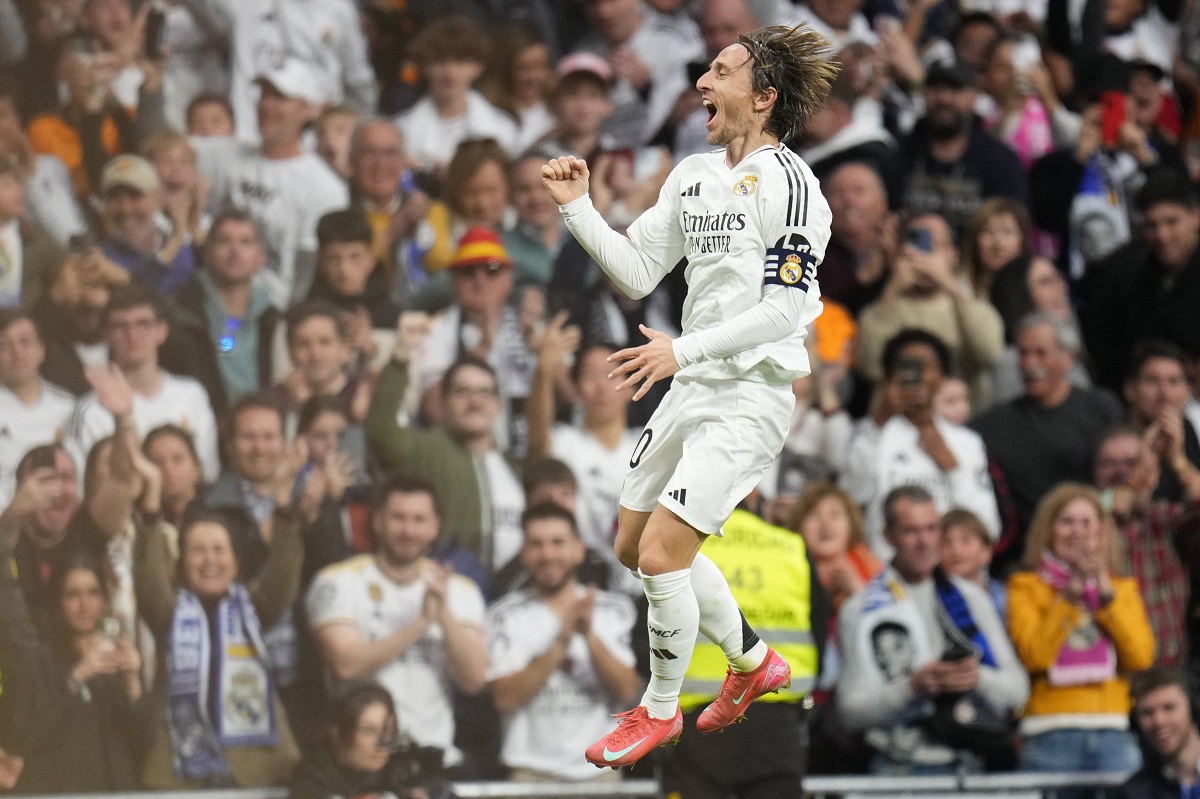 Real Madrid's Luka Modric celebrates after scoring the opening goal during the Spanish La Liga soccer match between Real Madrid and Girona at the Santiago Bernabeu stadium in Madrid, Spain, Sunday, Feb. 23, 2025. (AP Photo/Manu Fernandez)