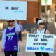 Ryan Safdarinia, left, and Lillian McCall hold signs reacting to the news that the Dallas Mavericks traded Luka Doncic to the Los Angeles Lakers outside the American Airlines Center, Sunday, Feb. 2, 2025, in Dallas. (Elias Valverde II/The Dallas Morning News via AP)