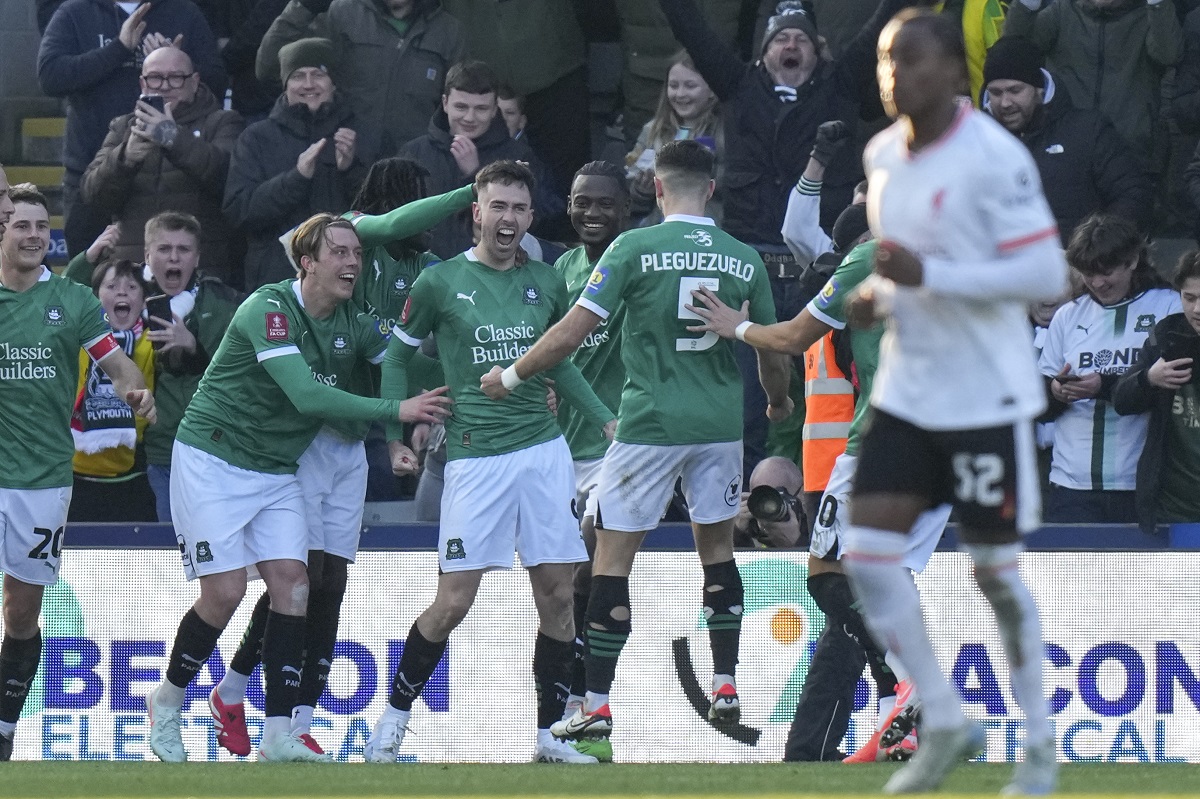 Plymouth Argyle's Ryan Hardie celebrates after scoring his side's opening goal from the penalty spot during the English FA Cup fourth round soccer match between Plymouth Argyle and Liverpool at Home Park stadium in Plymouth, England, Sunday, Feb. 9, 2025. (AP Photo/Alastair Grant)