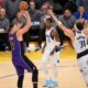 Los Angeles Lakers guard Luka Doncic (77) shoots over Dallas Mavericks guard Klay Thompson (31) during the second half of an NBA basketball game Tuesday, Feb. 25, 2025, in Los Angeles. (AP Photo/Kyusung Gong)