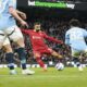 Liverpool's Mohamed Salah, center, scores his side's opening goal during the English Premier League soccer match between Manchester City and Liverpool at Etihad stadium in Manchester, England, Sunday, Feb. 23, 2025. (AP Photo/Dave Thompson)