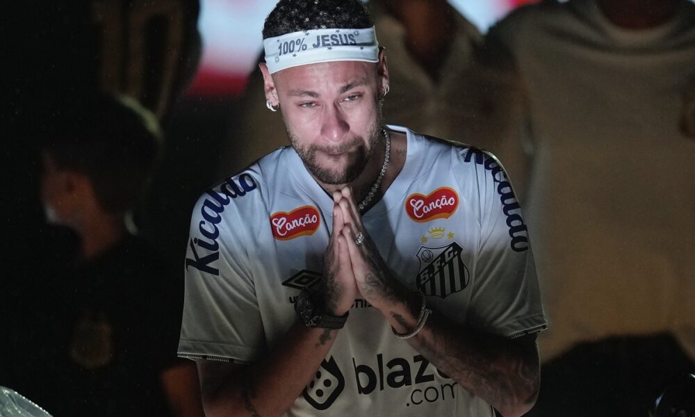 Brazilian soccer player Neymar reacts during his presentation ceremony after signing a six-month contract with Santos FC at Vila Belmiro Stadium in Santos, Brazil, Friday, Jan. 31, 2025. (AP Photo/Andre Penner)