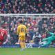 Liverpool's Mohamed Salah, left, shoots to score from the penalty spot during the English Premier League soccer match between Liverpool and Wolverhampton Wanderers at Anfield Stadium in Liverpool, Sunday, Feb. 16, 2025. (AP Photo/Ian Hodgson)