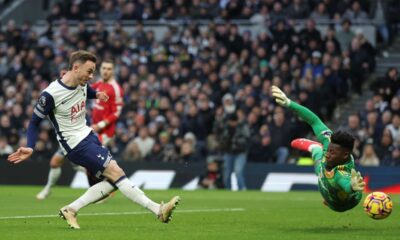 Tottenham's James Maddison scores the opening goal past Manchester United's goalkeeper Andre Onana during the English Premier League soccer match between Tottenham Hotspur and Manchester United in London, Sunday, Feb. 16, 2025. (AP Photo/Ian Walton)