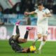 Napoli's Pasquale Mazzocchi, left, falls on the pitch challenged by Lazio's Adam Marusic during a Serie A soccer match between Lazio and Napoli in Rome, Italy, Saturday, Feb. 15, 2025. (AP Photo/Andrew Medichini)