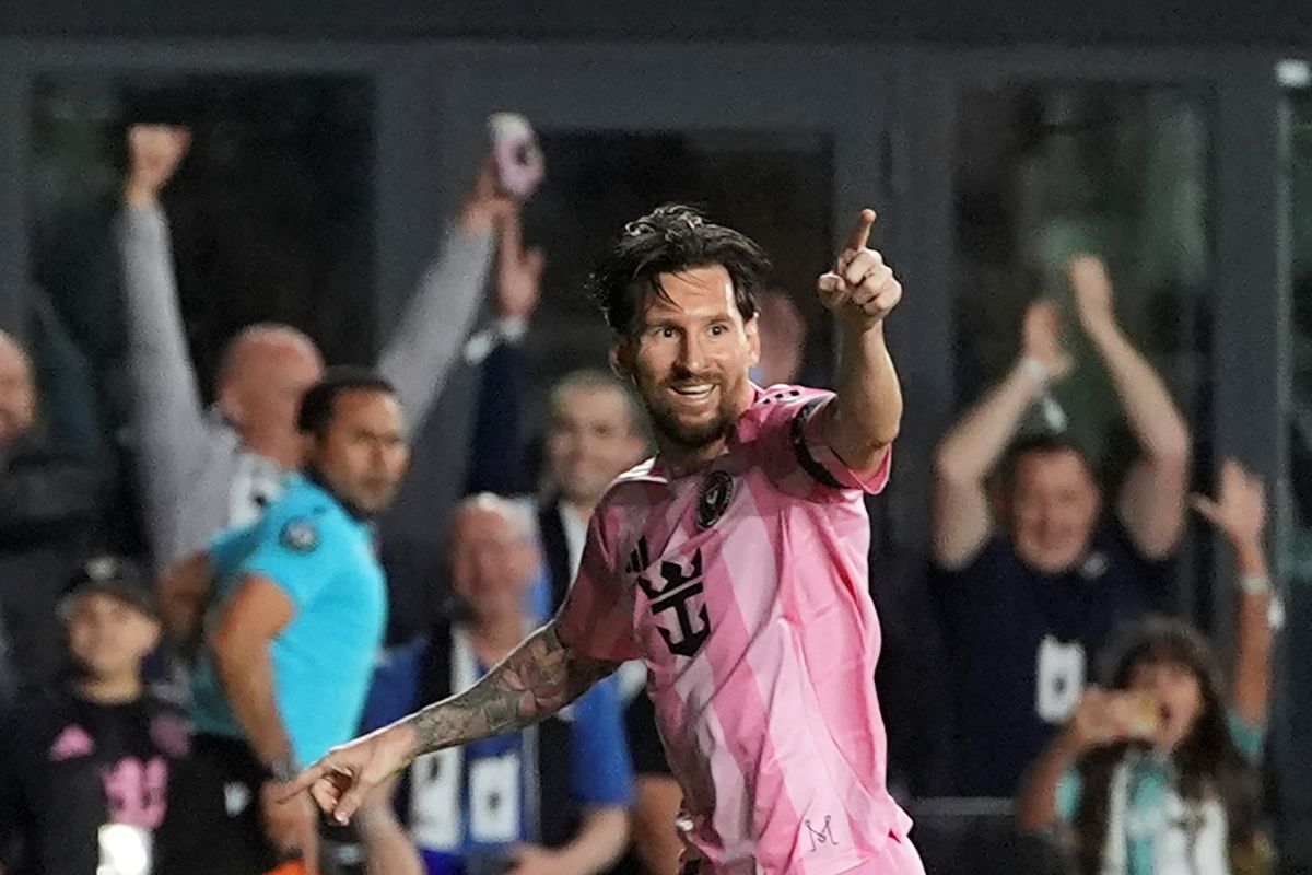 Inter Miami forward Lionel Messi (10) celebrates scoring his side's first goal against Sporting Kansas City during the first half of a CONCACAF Champions Cup soccer match, Tuesday, Feb. 25, 2025, in Fort Lauderdale, Fla. (AP Photo/Rebecca Blackwell)