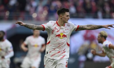 Leipzig's Benjamin Sesko celebrates after scoring his side's second goal during the German Bundesliga soccer match between RB Leipzig and 1. FC Heidenheim in Leipzig, Germany, Sunday, Feb. 23, 2025. (Hendrik Schmidt/dpa via AP)