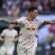 Leipzig's Benjamin Sesko celebrates after scoring his side's second goal during the German Bundesliga soccer match between RB Leipzig and 1. FC Heidenheim in Leipzig, Germany, Sunday, Feb. 23, 2025. (Hendrik Schmidt/dpa via AP)