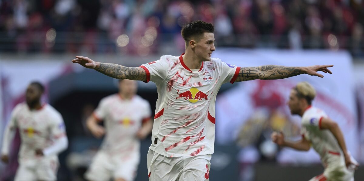 Leipzig's Benjamin Sesko celebrates after scoring his side's second goal during the German Bundesliga soccer match between RB Leipzig and 1. FC Heidenheim in Leipzig, Germany, Sunday, Feb. 23, 2025. (Hendrik Schmidt/dpa via AP)