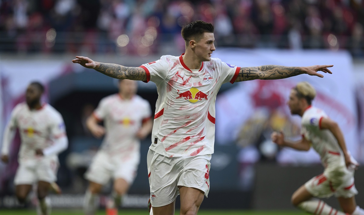 Leipzig's Benjamin Sesko celebrates after scoring his side's second goal during the German Bundesliga soccer match between RB Leipzig and 1. FC Heidenheim in Leipzig, Germany, Sunday, Feb. 23, 2025. (Hendrik Schmidt/dpa via AP)