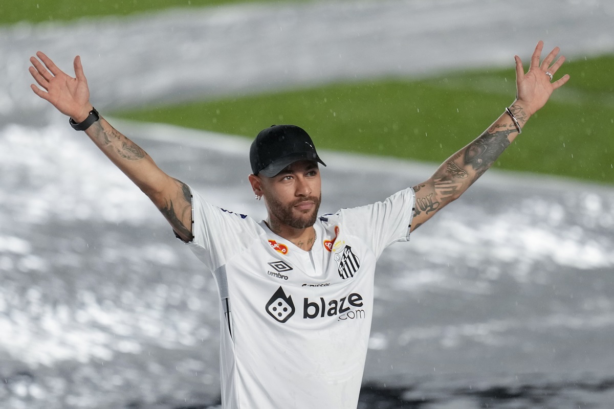 Brazilian soccer player Neymar waves to fans during his presentation ceremony after signing a six-month contract with Santos FC at Vila Belmiro Stadium in Santos, Brazil, Friday, Jan. 31, 2025. (AP Photo/Andre Penner)