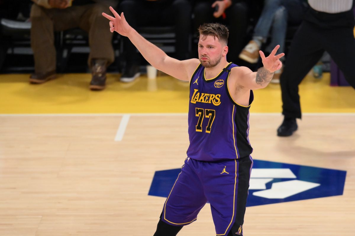 Los Angeles Lakers guard Luka Doncic reacts after Austin Reaves' 3-point basket during the first half of an NBA basketball game against the Dallas Mavericks, Tuesday, Feb. 25, 2025, in Los Angeles. (AP Photo/Kyusung Gong)