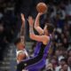 Los Angeles Lakers guard Luka Doncic, right, shoots a basket over Denver Nuggets forward Michael Porter Jr. in the second half of an NBA basketball game, Saturday, Feb. 22, 2025, in Denver. (AP Photo/David Zalubowski)