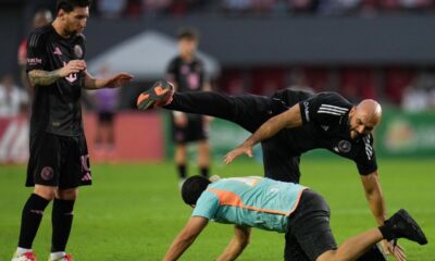 Lionel Messi's personal bodyguard tries to catch a fan who ran onto the field during a friendly soccer match between the United States' Inter Miami and Panama's Sporting San Miguelito in Panama City, Sunday, Feb. 2, 2025. (AP Photo/Matias Delacroix)