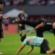 Lionel Messi's personal bodyguard tries to catch a fan who ran onto the field during a friendly soccer match between the United States' Inter Miami and Panama's Sporting San Miguelito in Panama City, Sunday, Feb. 2, 2025. (AP Photo/Matias Delacroix)