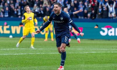 Bochum's Georgios Masouras celebrates after scoring his side's second goal during the German Bundesliga soccer match between VfL Bochum and Borussia Dortmund in Bochum, Germany, Saturday, Feb. 15, 2025. (David Inderlied/dpa via AP)