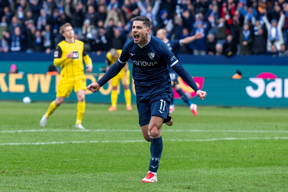 Bochum's Georgios Masouras celebrates after scoring his side's second goal during the German Bundesliga soccer match between VfL Bochum and Borussia Dortmund in Bochum, Germany, Saturday, Feb. 15, 2025. (David Inderlied/dpa via AP)