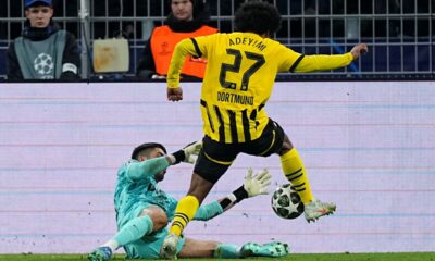 Sporting's goalkeeper Rui Silva fouls Dortmund's Karim Adeyemi inside the penalty box during the Champions League playoff second leg soccer match between Borussia Dortmund and Sporting CP at the Signa-Iduna Park in Dortmund, Germany, Wednesday, Feb. 19, 2025. (AP Photo/Martin Meissner)