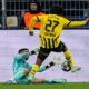 Sporting's goalkeeper Rui Silva fouls Dortmund's Karim Adeyemi inside the penalty box during the Champions League playoff second leg soccer match between Borussia Dortmund and Sporting CP at the Signa-Iduna Park in Dortmund, Germany, Wednesday, Feb. 19, 2025. (AP Photo/Martin Meissner)