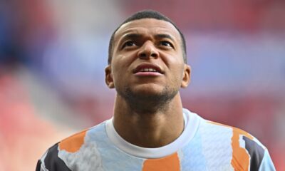 Real Madrid's Kylian Mbappe takes part in the warm up during a Spanish La Liga soccer match between Osasuna and Real Madrid at El Sardar stadium in Pamplona, Spain, Saturday, Feb. 15, 2025. (AP Photo/Miguel Oses)