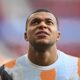 Real Madrid's Kylian Mbappe takes part in the warm up during a Spanish La Liga soccer match between Osasuna and Real Madrid at El Sardar stadium in Pamplona, Spain, Saturday, Feb. 15, 2025. (AP Photo/Miguel Oses)