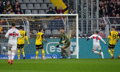 Stuttgart players celebrate after Dortmund's Waldemar Anton scored an own goal during the German Bundesliga soccer match between Borussia Dortmund and VfB Stuttgart at the Signal-Iduna Park in Dortmund, Germany, Saturday, Feb. 8, 2025. (AP Photo/Martin Meissner)